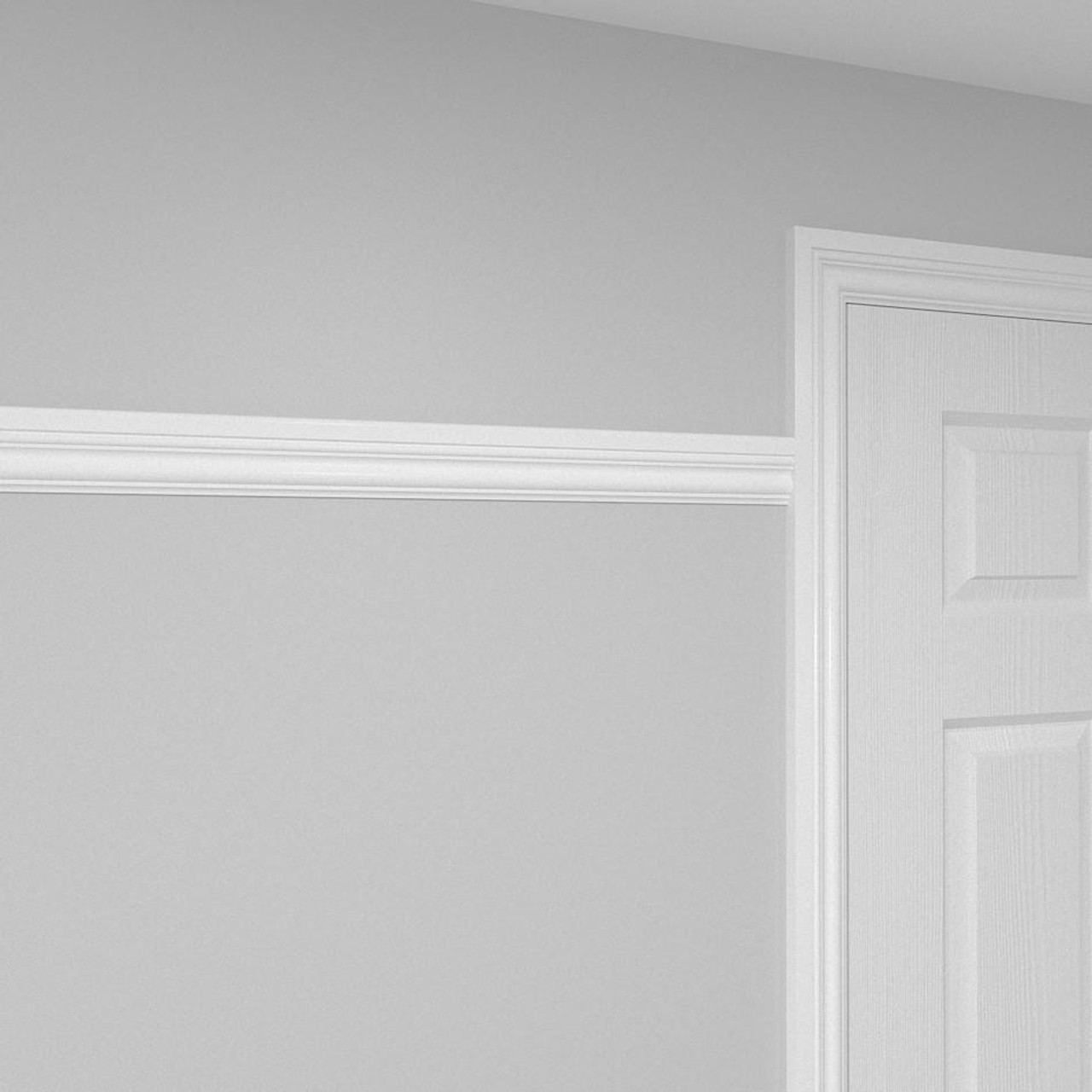 A picture rail installed on a wall, conjoined to architraves.