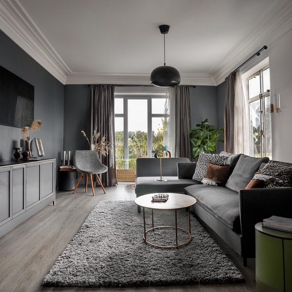 Chic living space with soft grey hues creating a subtle and refined ambiance.