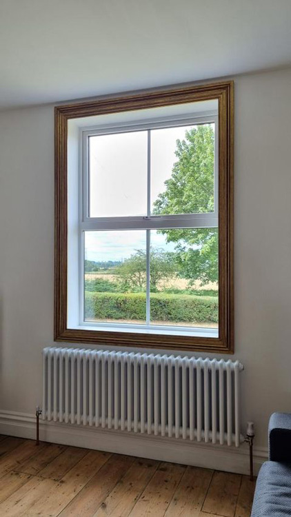 Decorative Moulding Used To Frame A Window In A Victorian Home