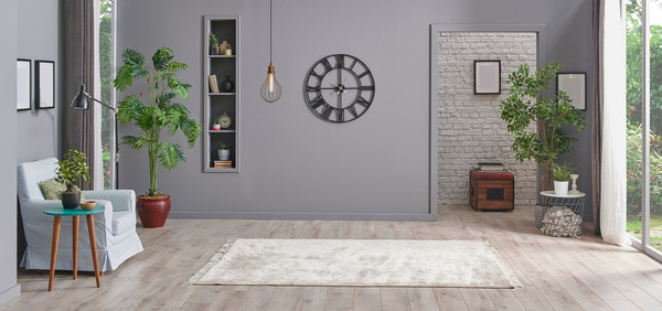 Eclectic room with grey accents and brick features creating a modern yet warm ambiance.