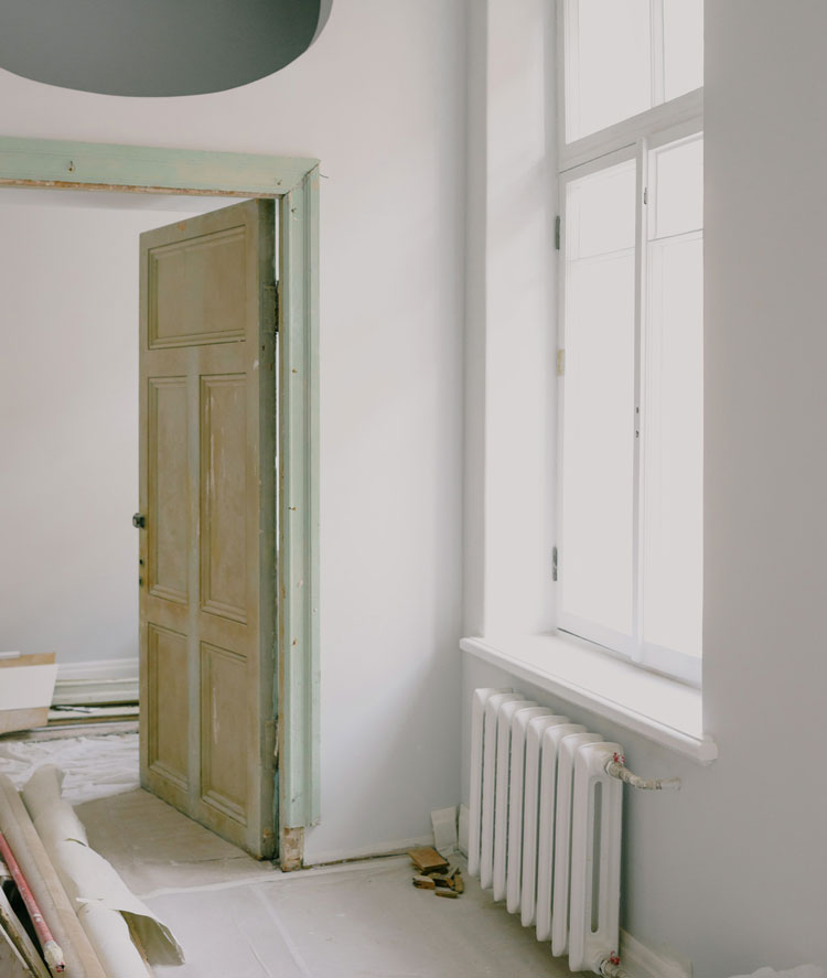 Photograph of af unfinished door after being hung