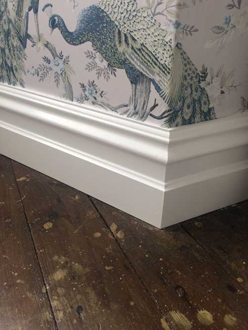 Skirting boards fitted with decorative wallpaper
