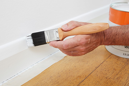 Using Masking Tape To Protect Carpet And Flooring Whilst Painting Skirting Boards