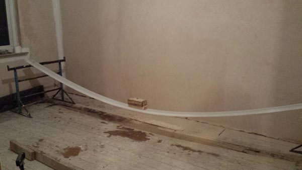 Using Weight To Gradually Bend The Skirting Board Into Shape