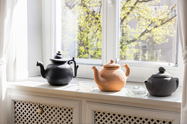 Teapots on a window sill