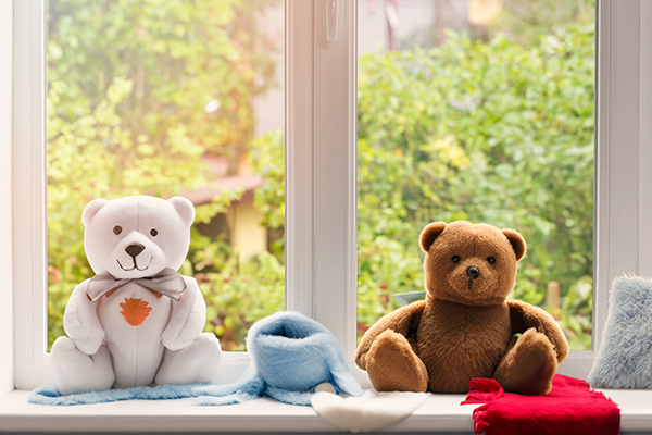 Teddy bears on a window sill